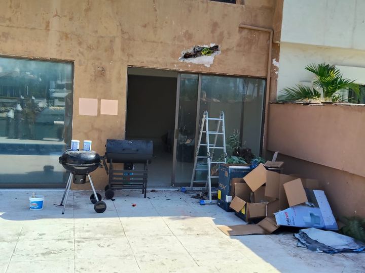 Sliding glazing being installed at a house with a pool