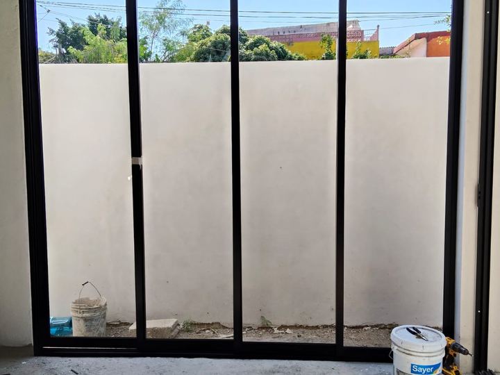 Four-panel black aluminum sliding enclosure