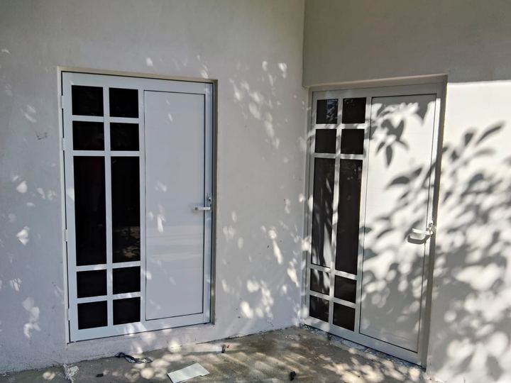 White aluminum entry door with grid glazing and side window