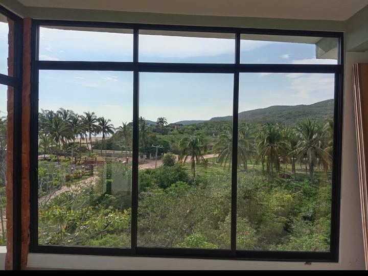 Fixed black aluminum picture window looking out to the mountains in Mayto