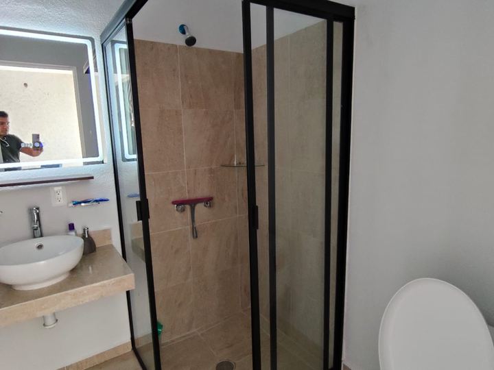 Corner enclosure with black frame and tempered glass