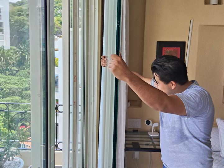Glass replacement in an apartment window overlooking the bay
