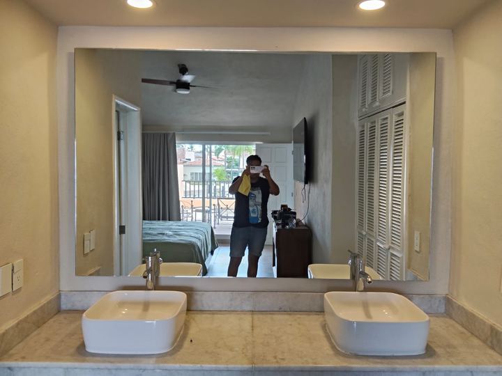 Large-format mirror above a double vanity