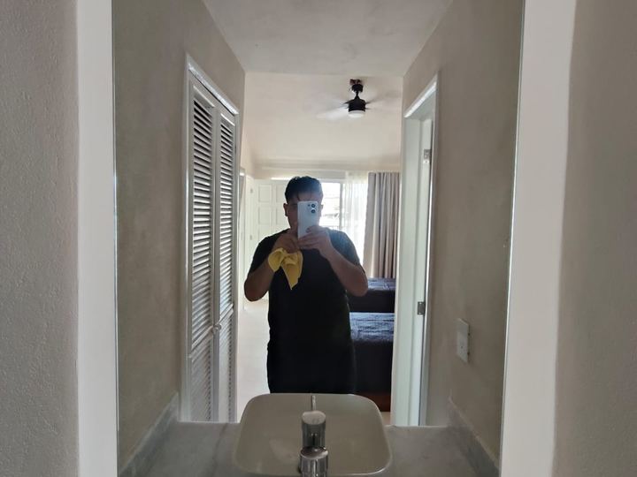 Custom rectangular mirror above a vanity