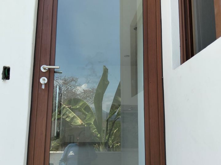Wood-finish aluminum door with full-height glass