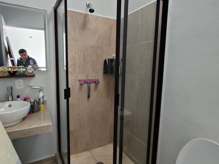 Corner enclosure with black frame and tempered glass