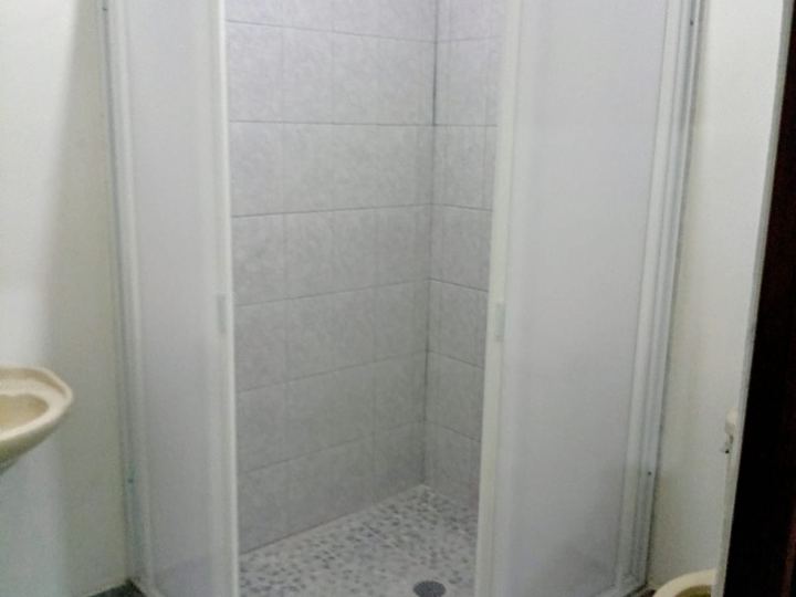 Sliding corner enclosure with a white frame