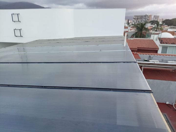 Polycarbonate roof on a rooftop overlooking the city