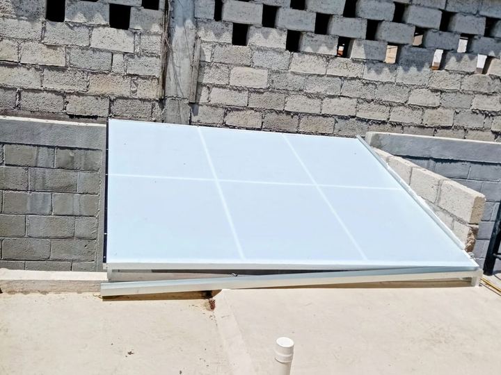 Flat skylight with an aluminum structure over a patio