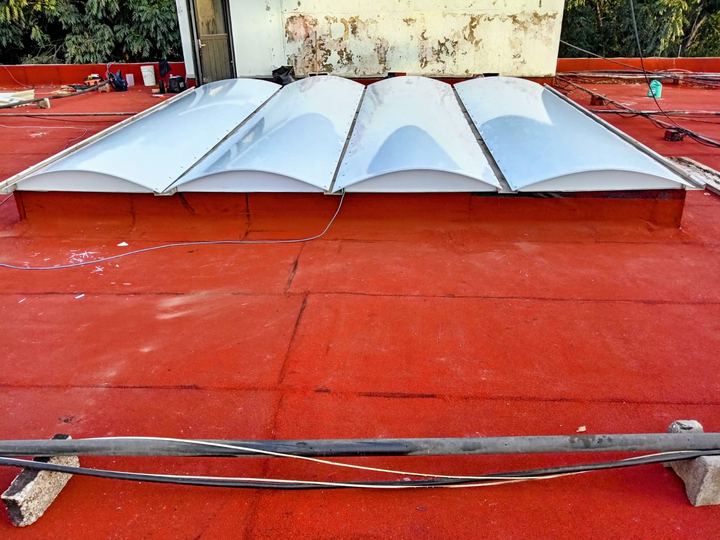 Four-panel curved skylight on a rooftop