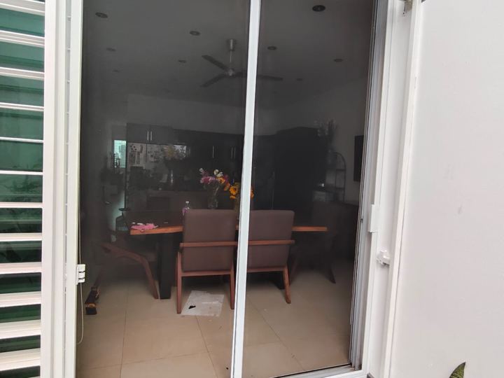 White aluminum sliding insect screen on patio glazing